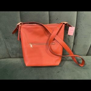 BRAND NEW Coach crossbody bag. Outside and inside pockets. Adjustable strap.